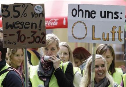 Members of German air carrier Lufthansa cabin crew union "UFO" take part in demonstration during strike at Berlin's Tegel airport